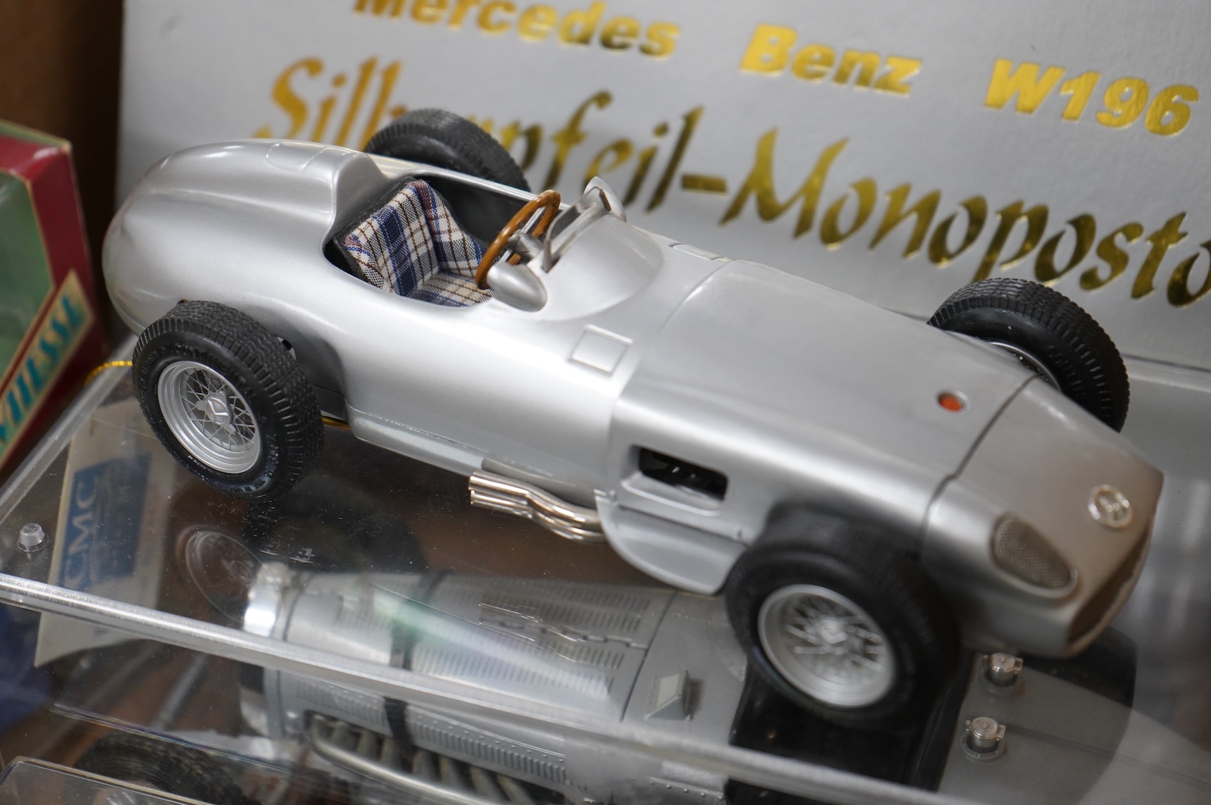 A collection of diecast vehicles, including a boxed CMC 1:18 scale Mercedes Benz W196 1950s single seat racing car, together with five boxed early Matchbox Models of Yesteryear, two Atlas Dinkies, a 1:18 scale Bburago Bu